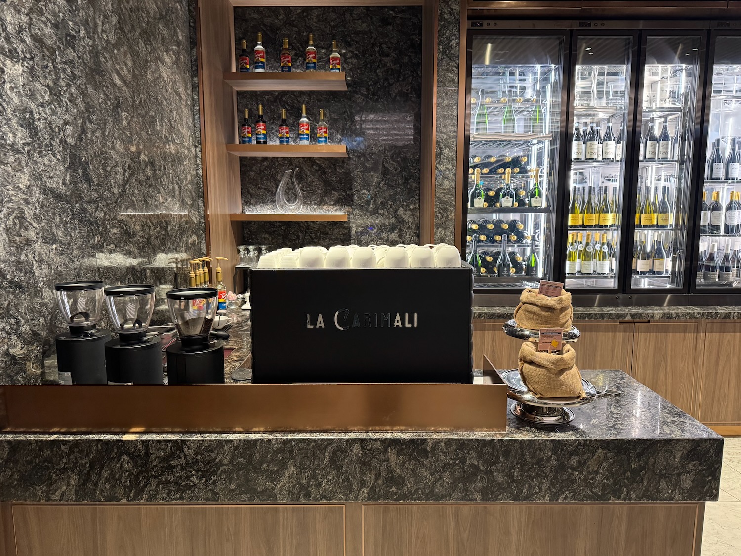 a bar with a laptop and blenders