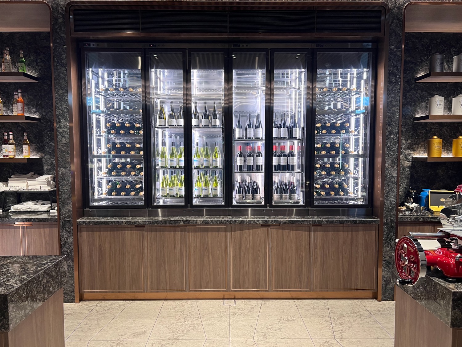 a wine cooler with bottles of wine in it