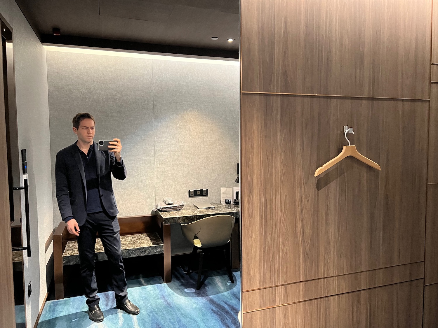 a man taking a selfie in a room