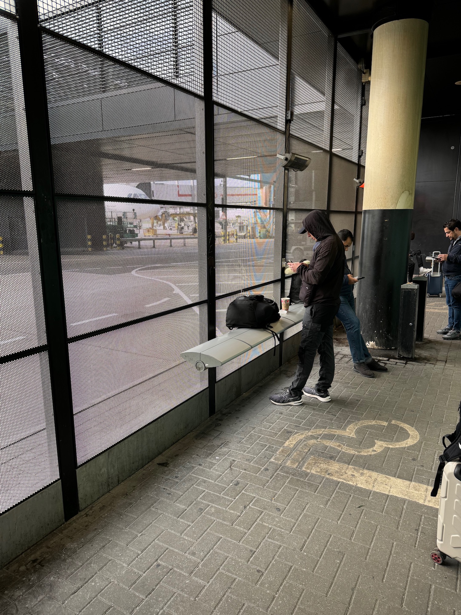 a group of people standing next to a window