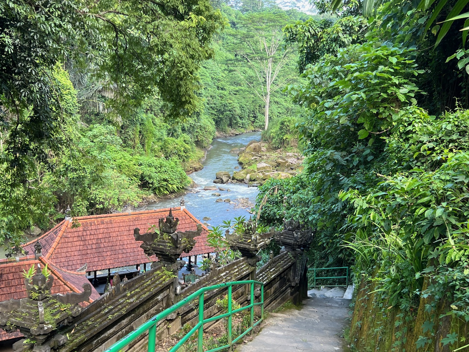 a walkway leading to a river