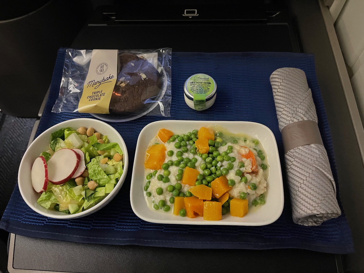 a plate of food on a blue place mat