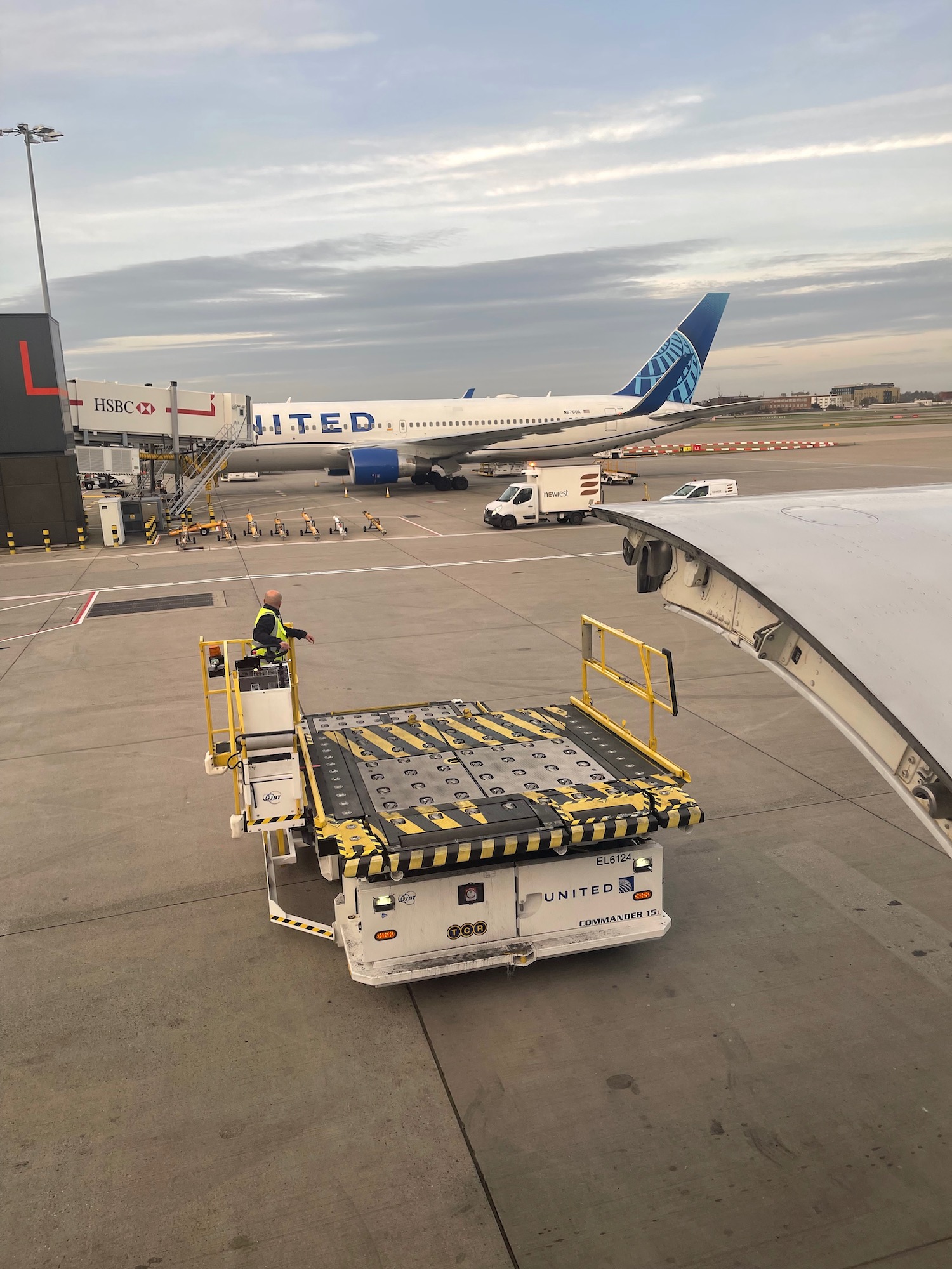 a man standing on a platform next to a plane