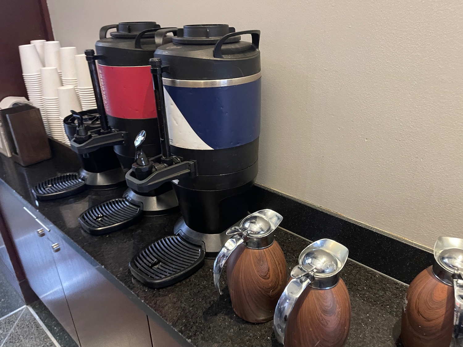 a group of coffee machines on a counter