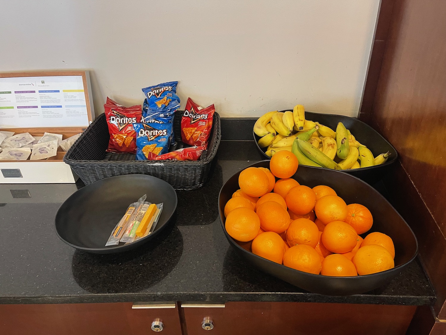 a group of bowls of food and snacks on a counter