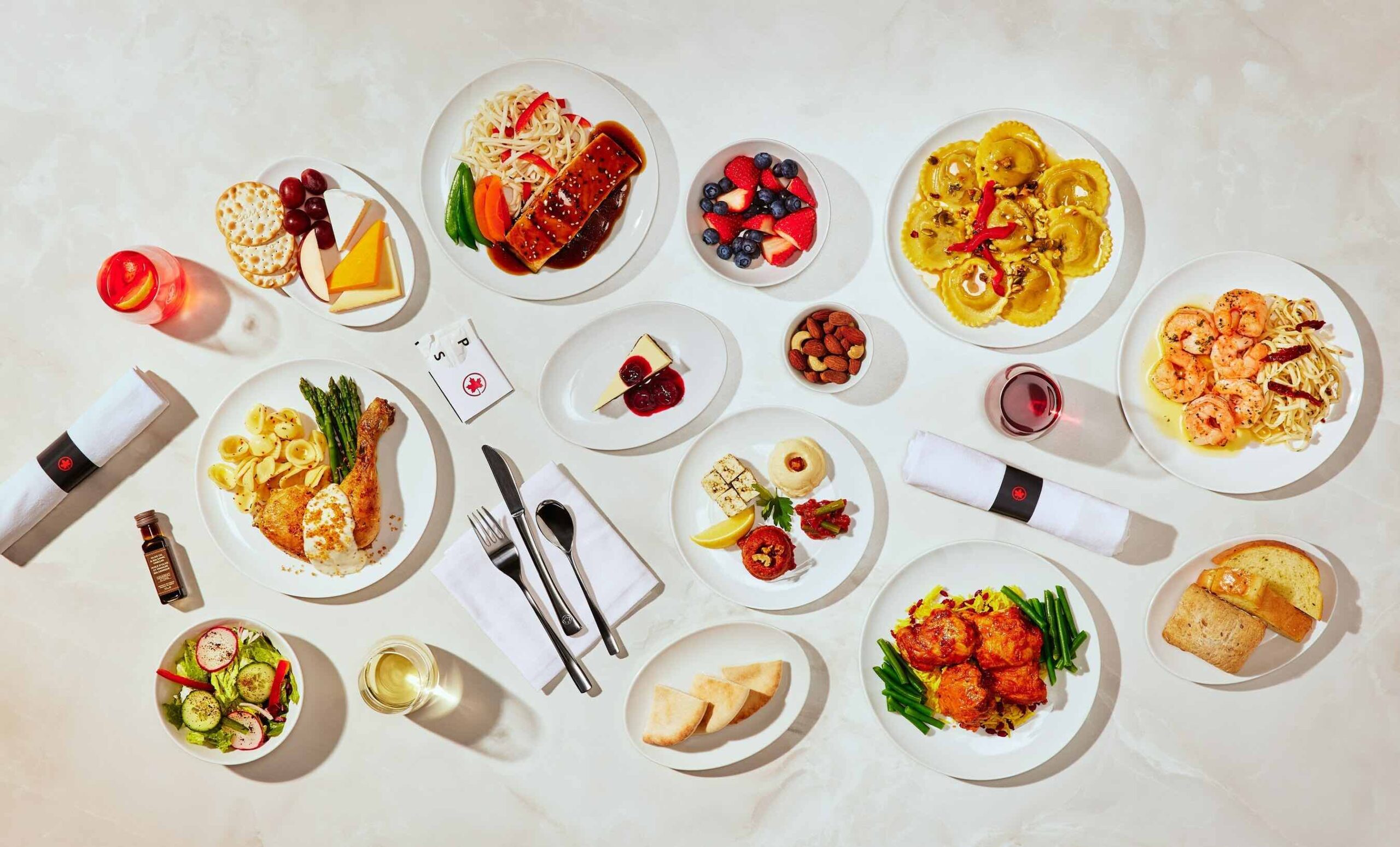 a table with plates of food and drinks