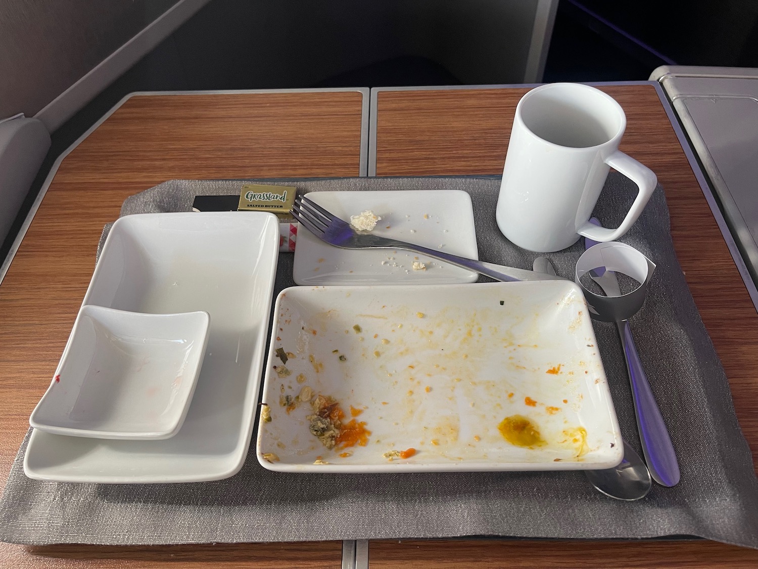 a plate and utensils on a table