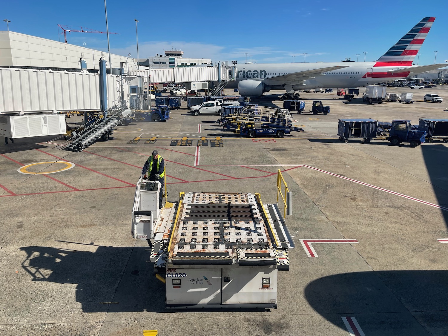 a man standing on a platform next to a plane