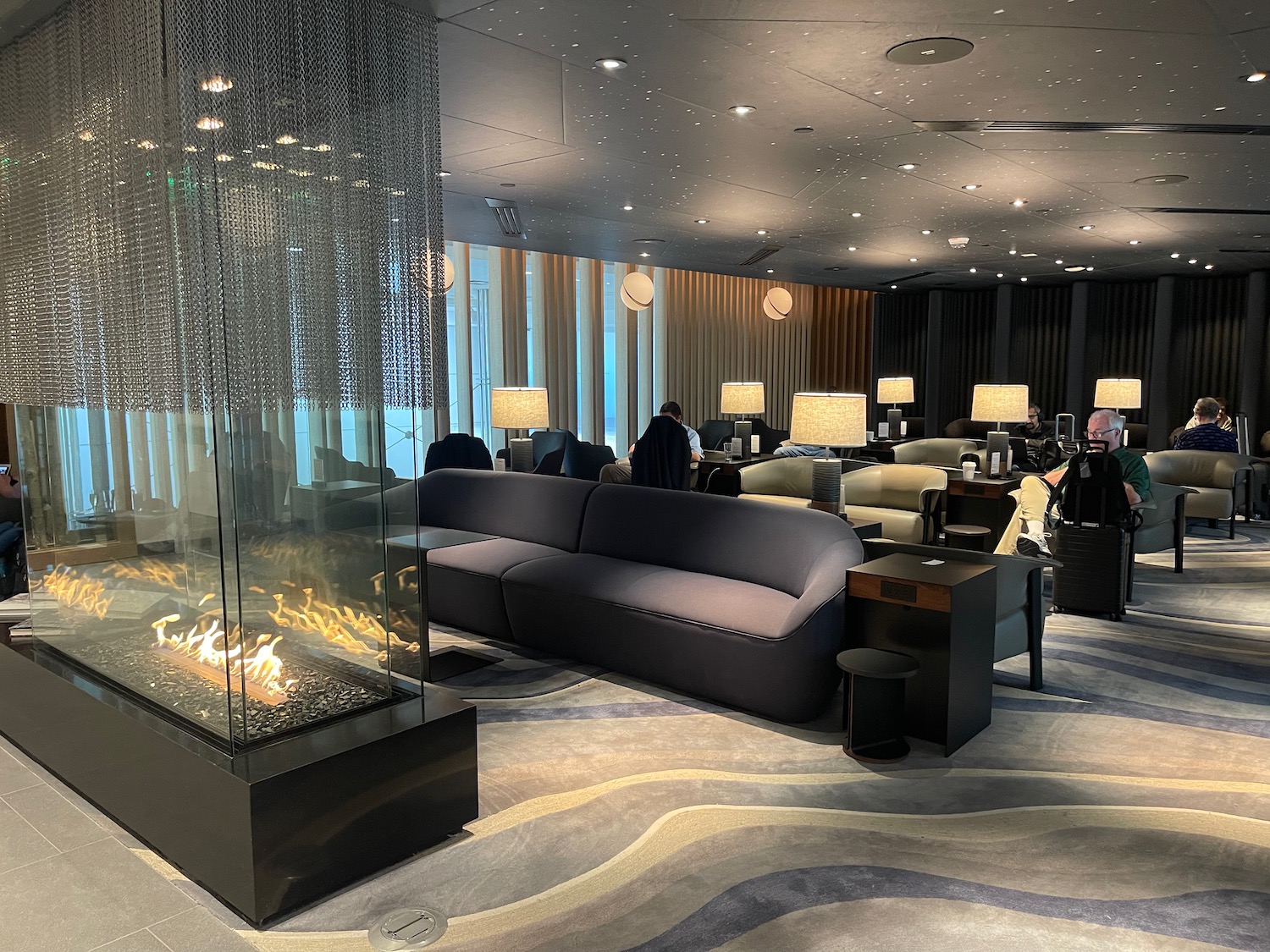 a room with a fireplace and couches