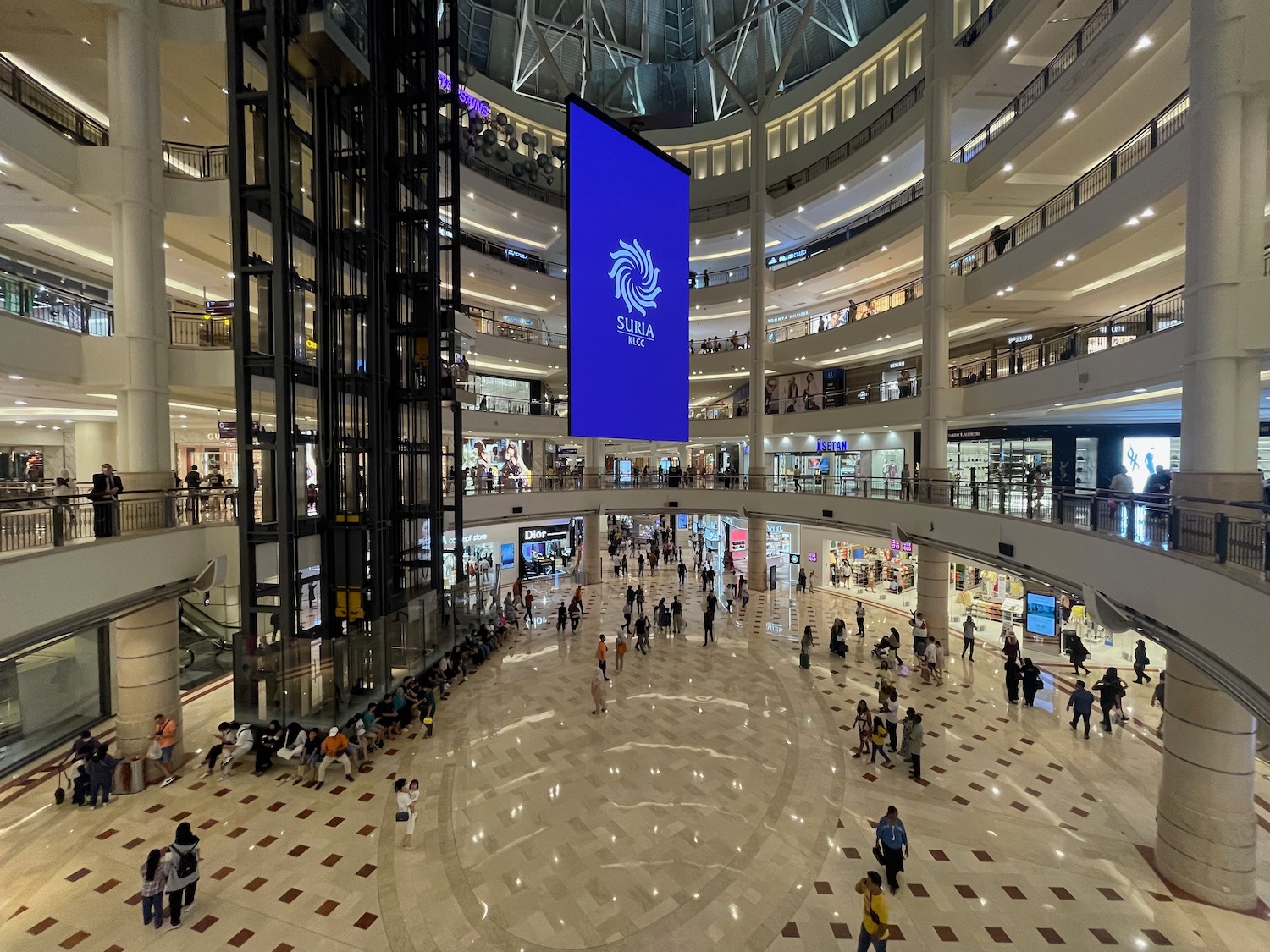 a large building with many floors and a large screen