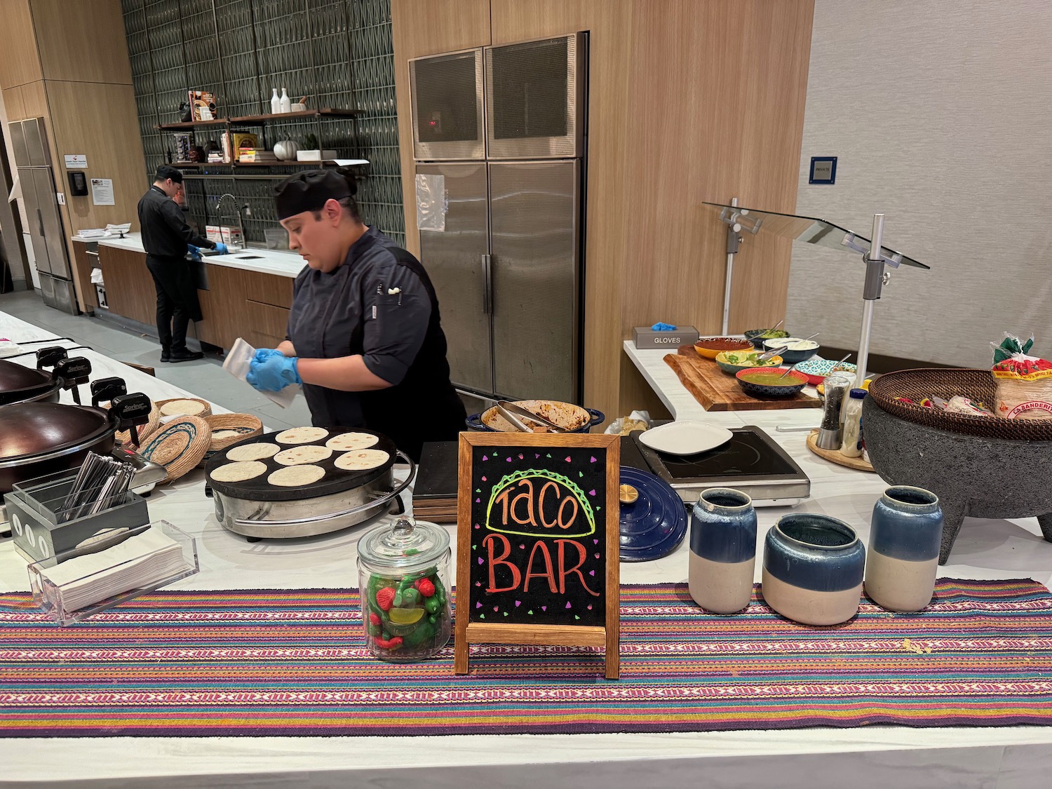 a man in a black hat cooking food