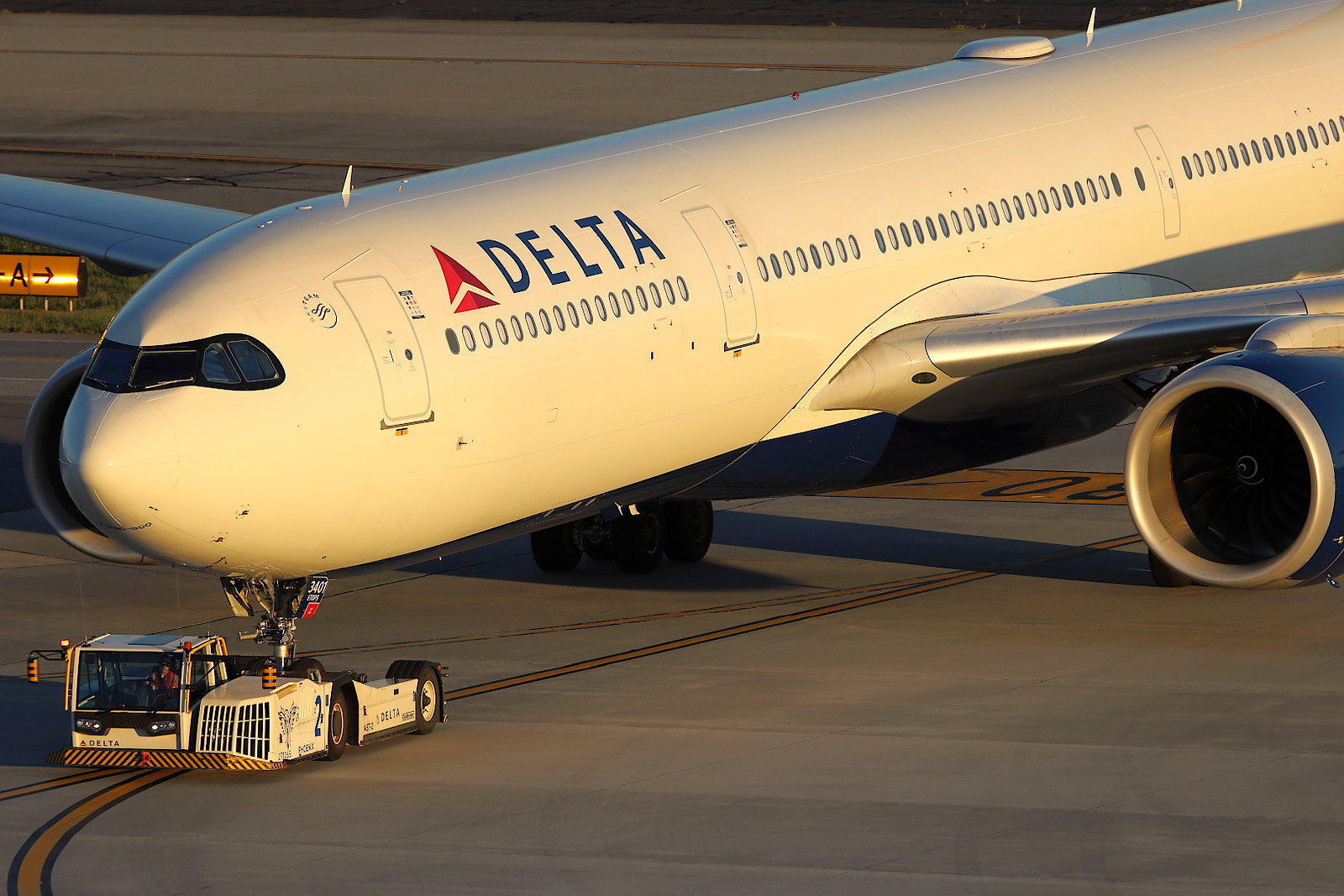 a large white airplane on a runway