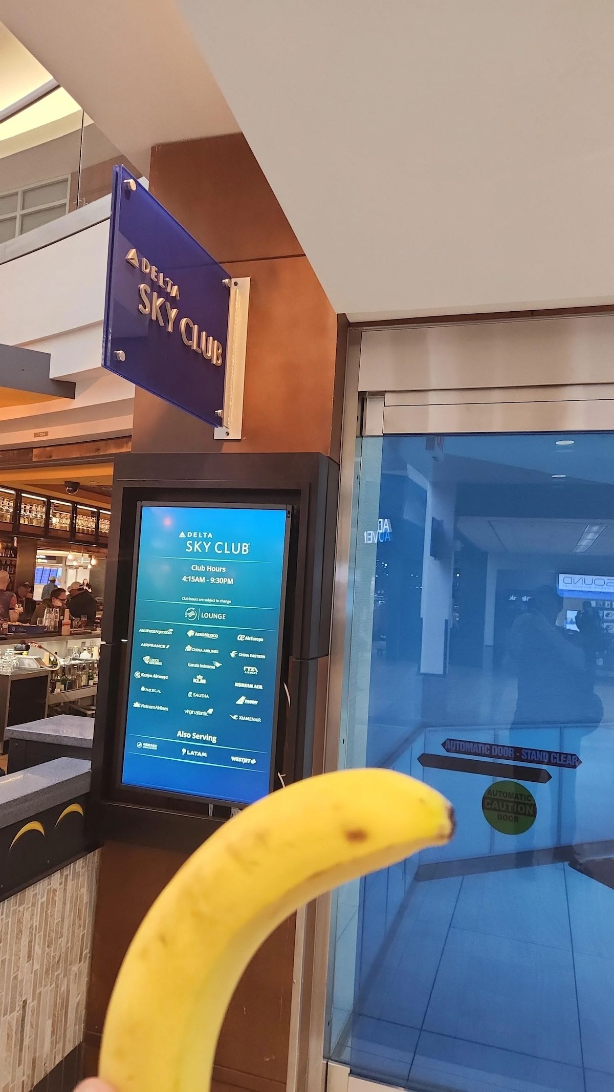 a banana in front of a sign