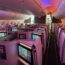 a row of monitors on an airplane