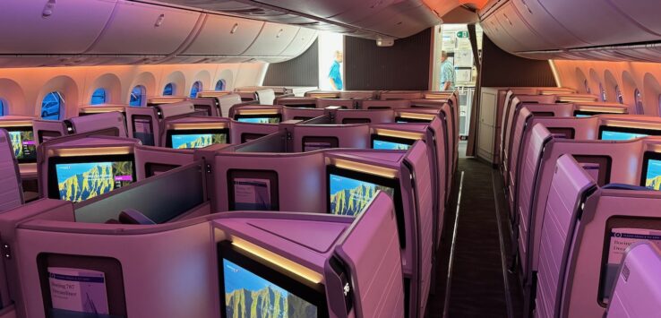 a row of monitors on an airplane