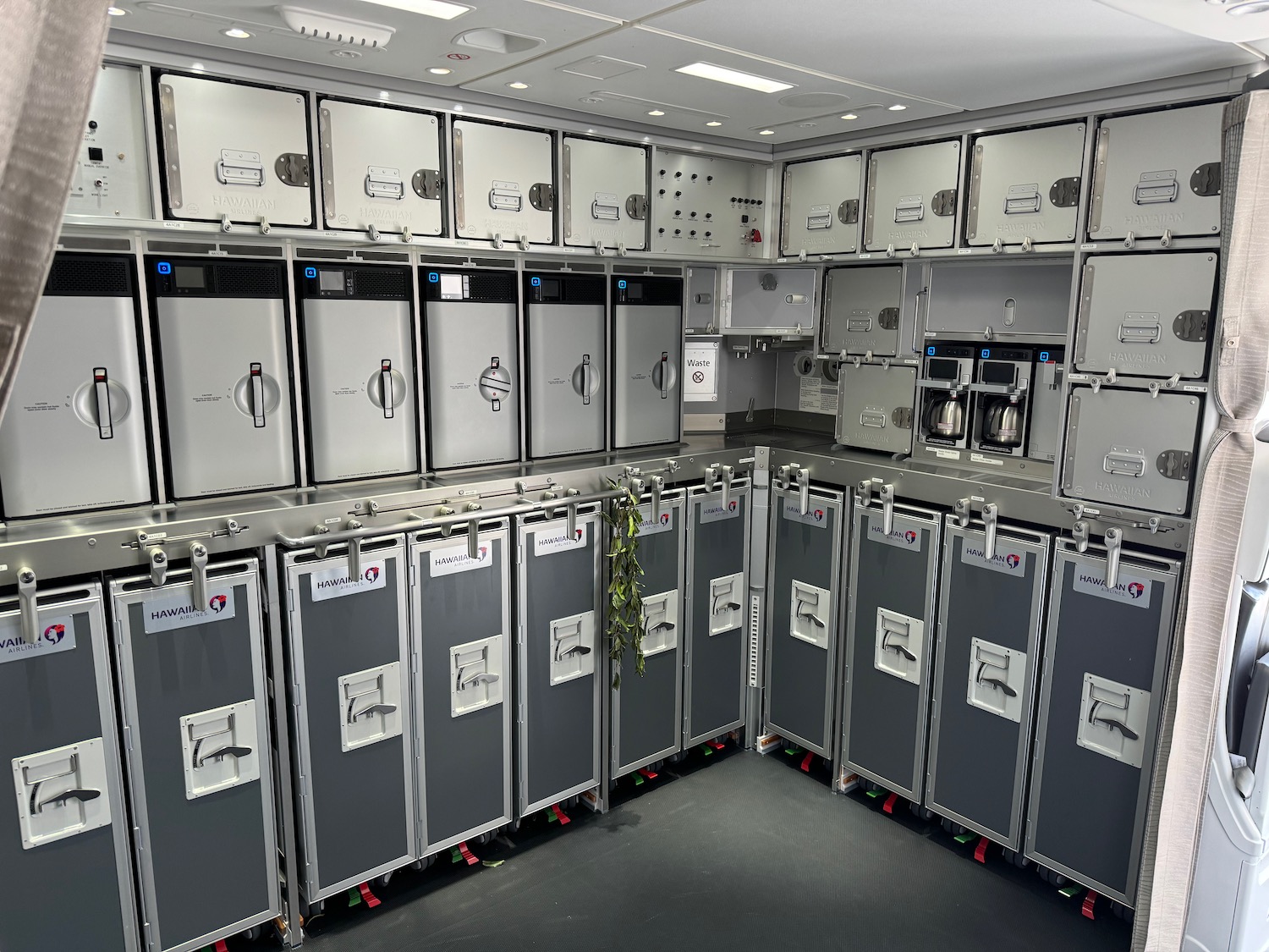 a room with many silver cabinets