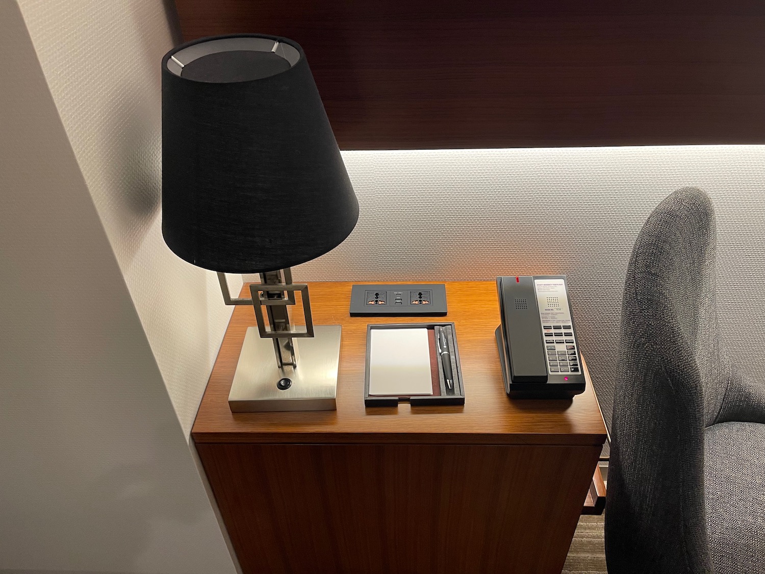 a lamp and phone on a table
