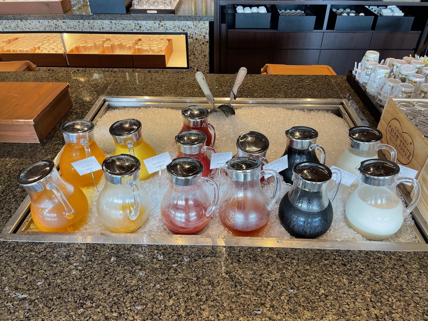 a tray of different colored drinks