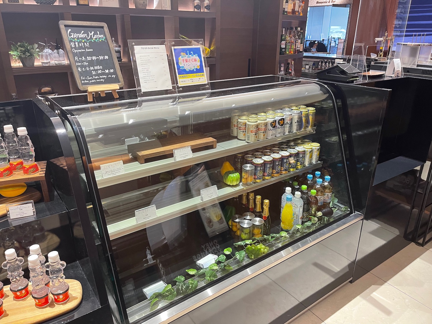 a display case with drinks and beverages