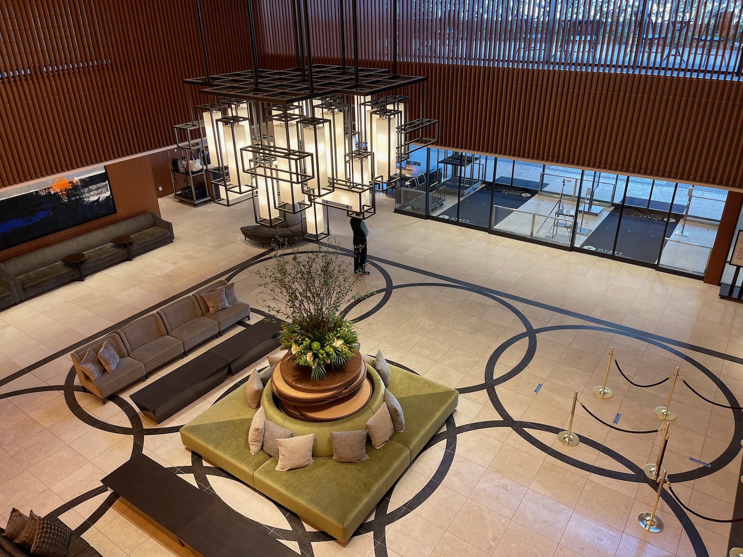 a large room with a large planter and a large chandelier