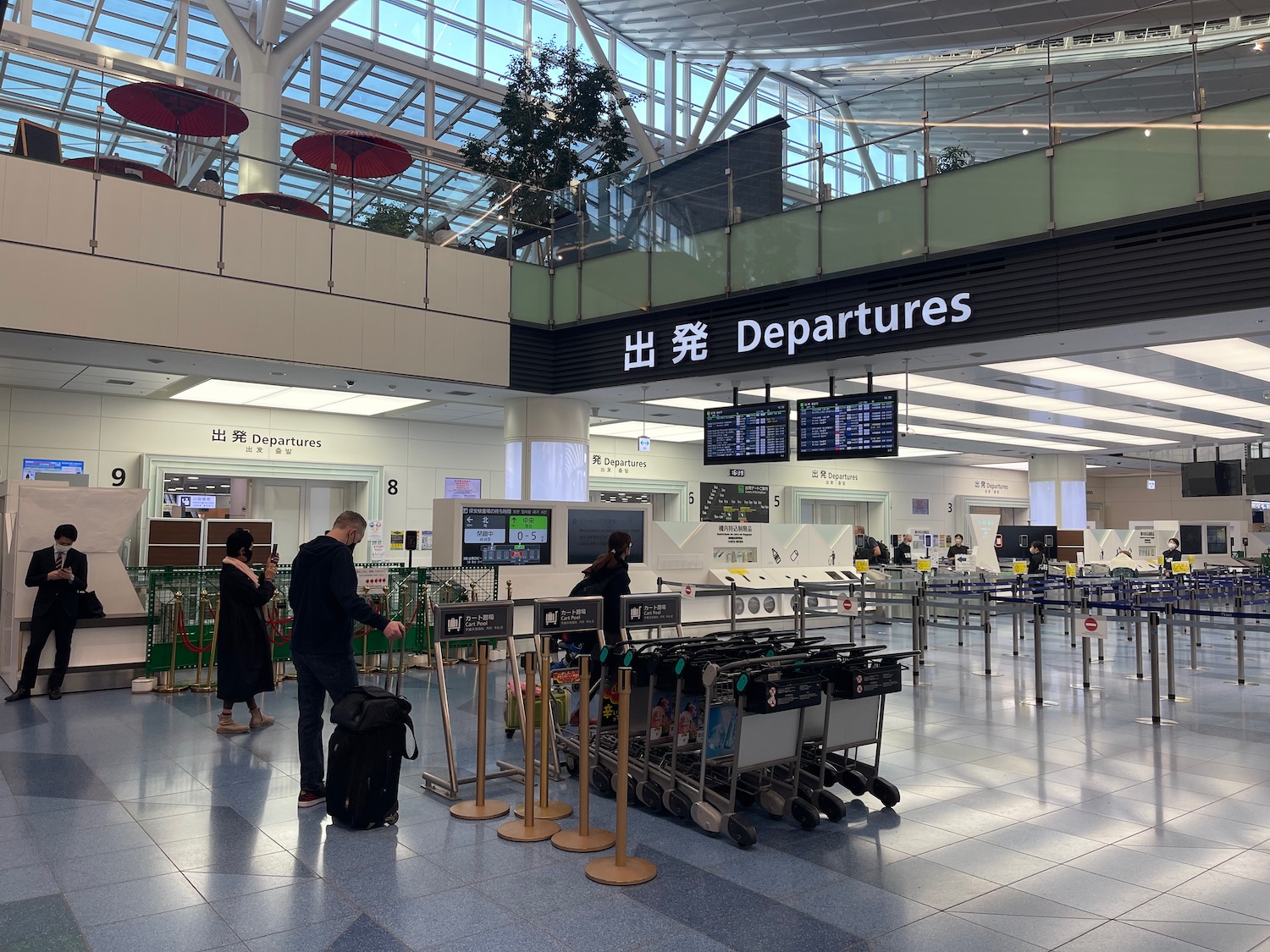 people standing in a large airport