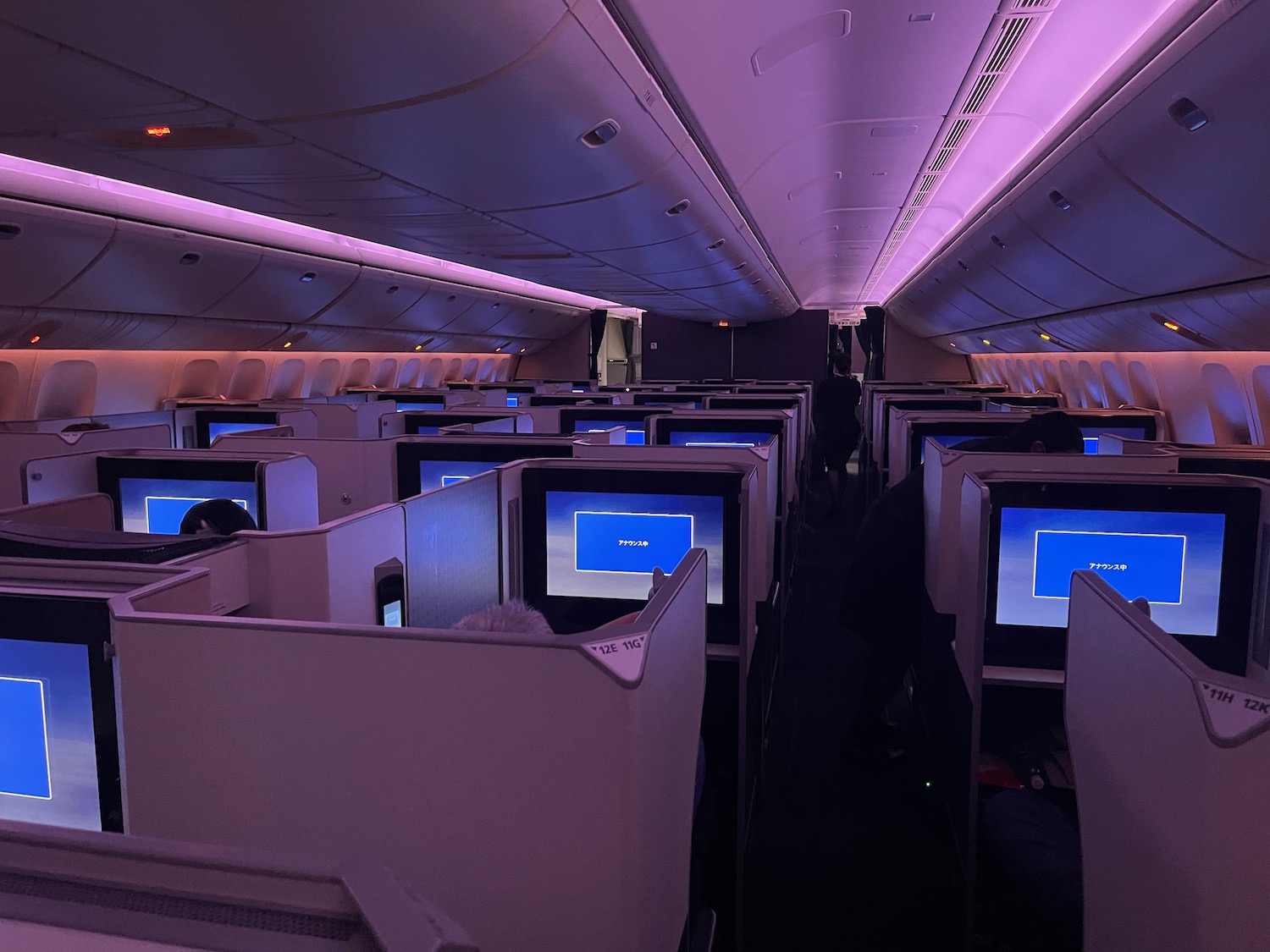 a row of monitors on an airplane