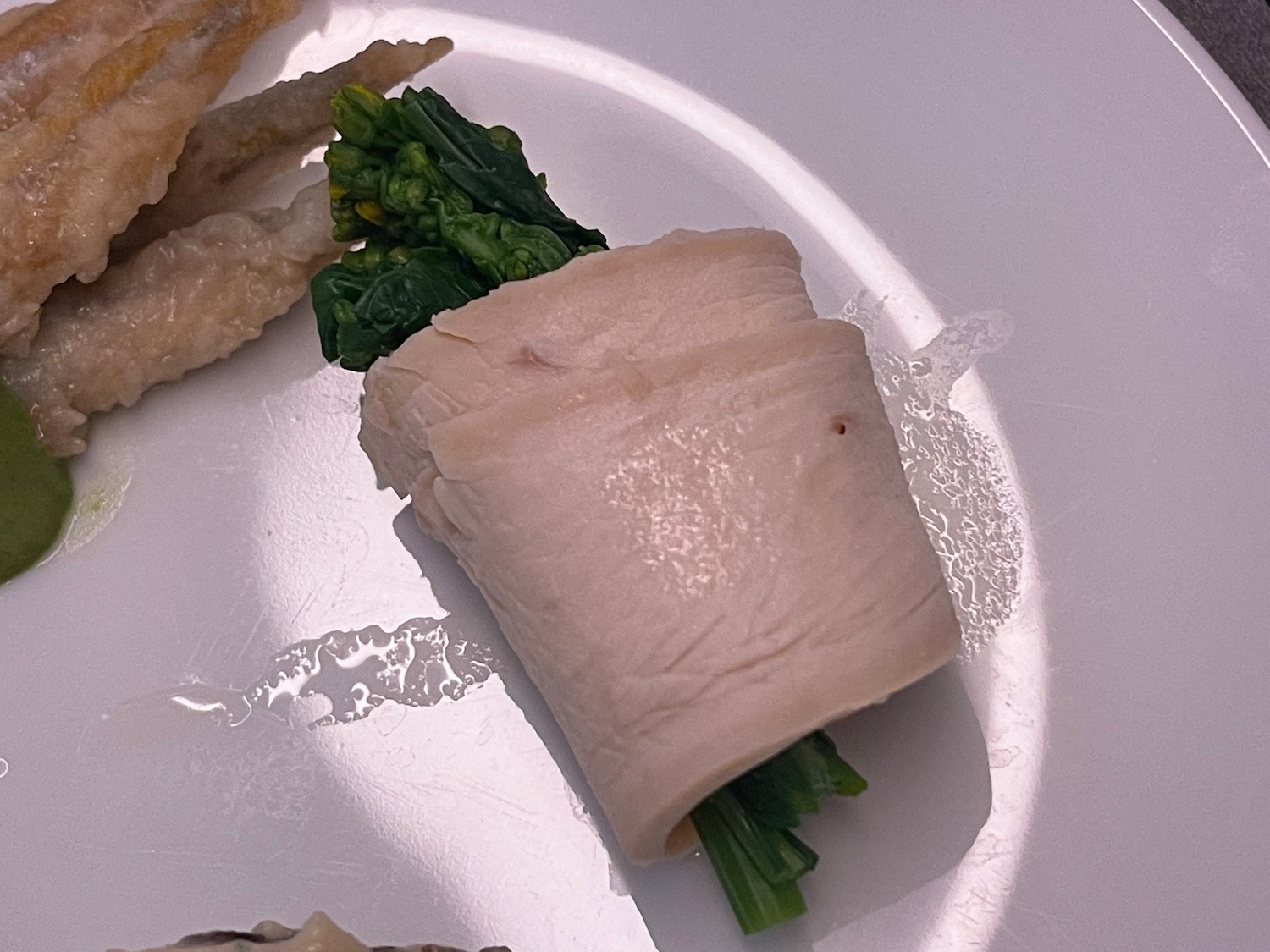 a plate of food on a white surface