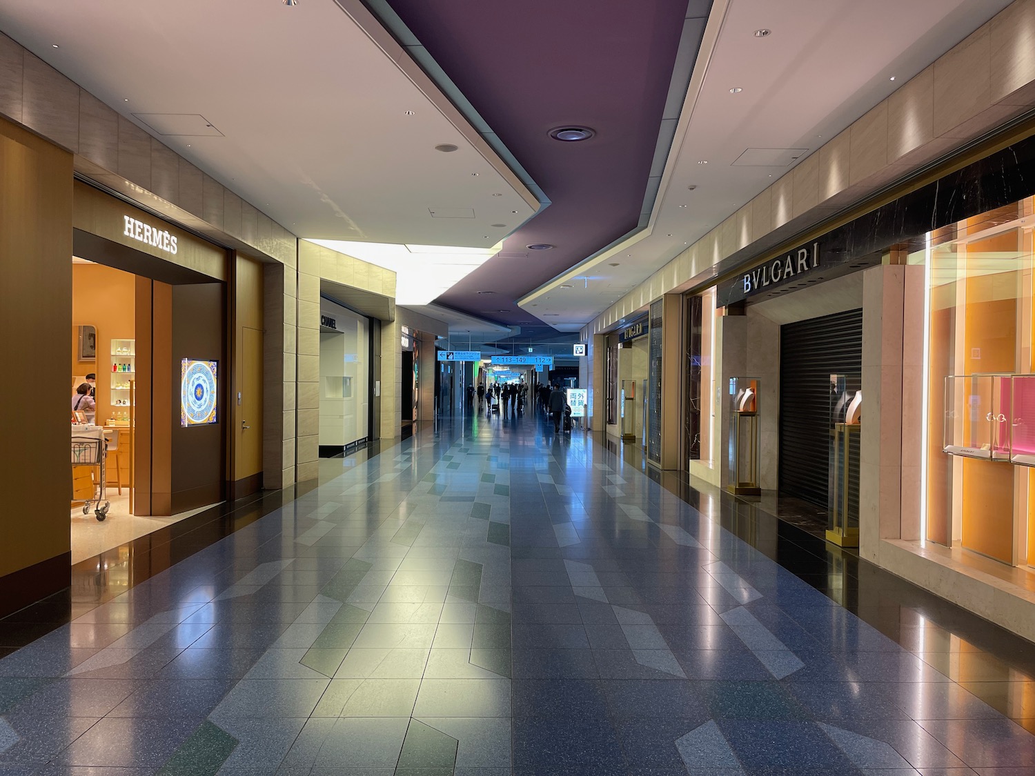 a hallway with many stores