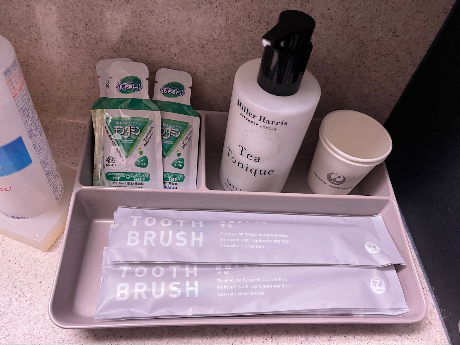 a tray with a toothbrush and toothpaste