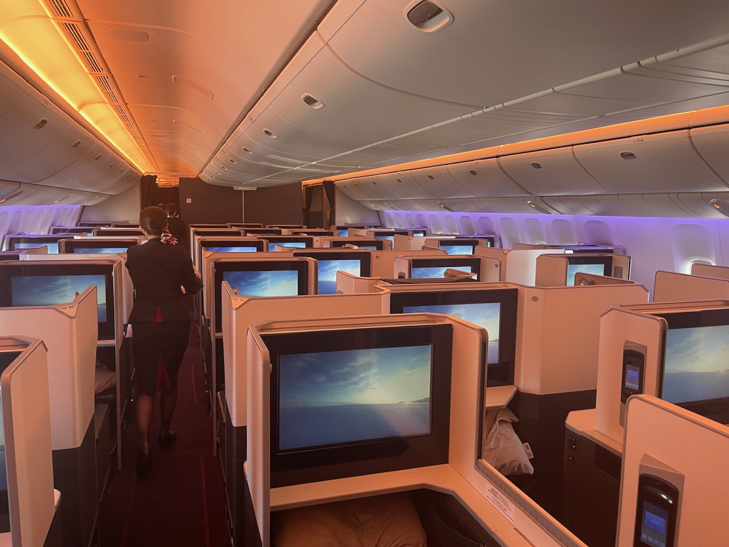 a row of monitors on an airplane