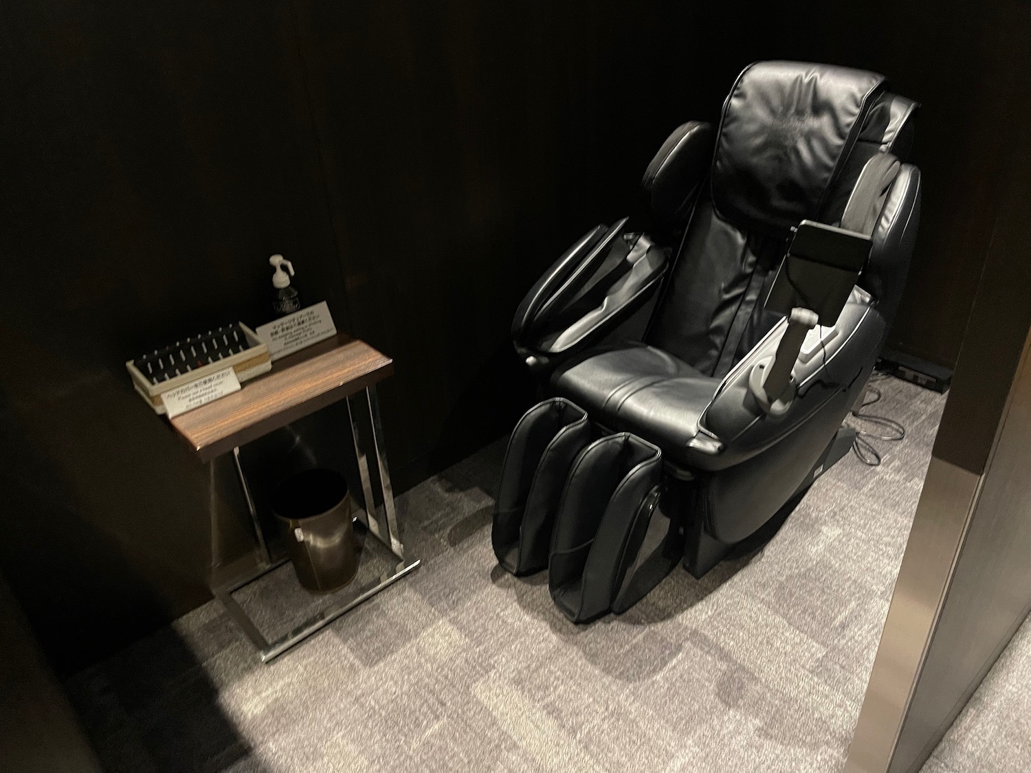 a black recliner chair in a room
