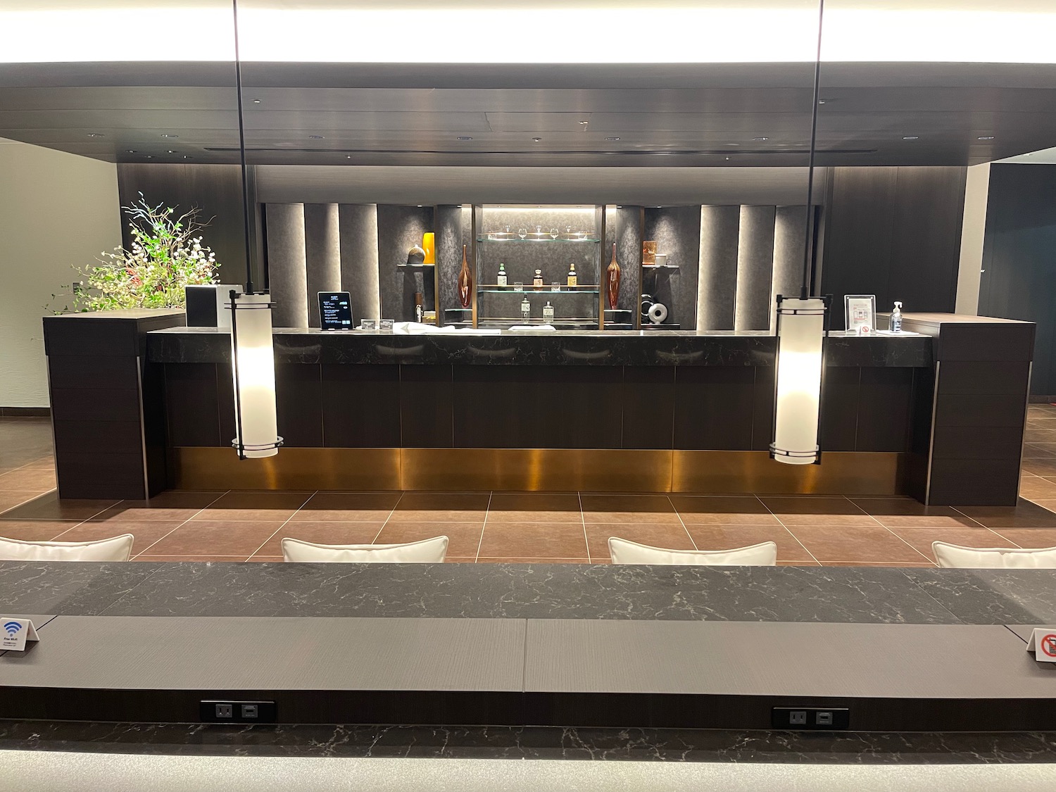 a bar with lights and a counter