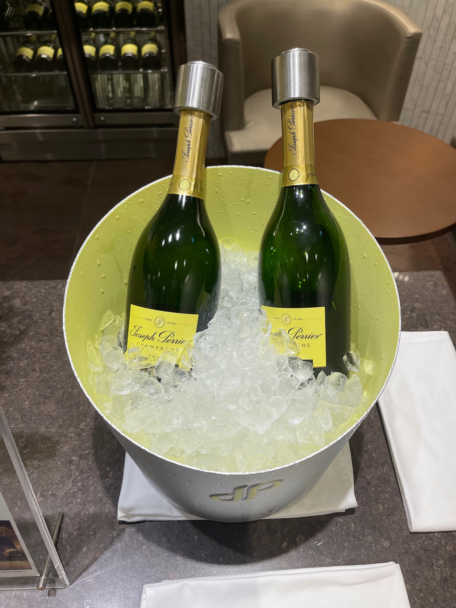 a bucket of ice with bottles of wine