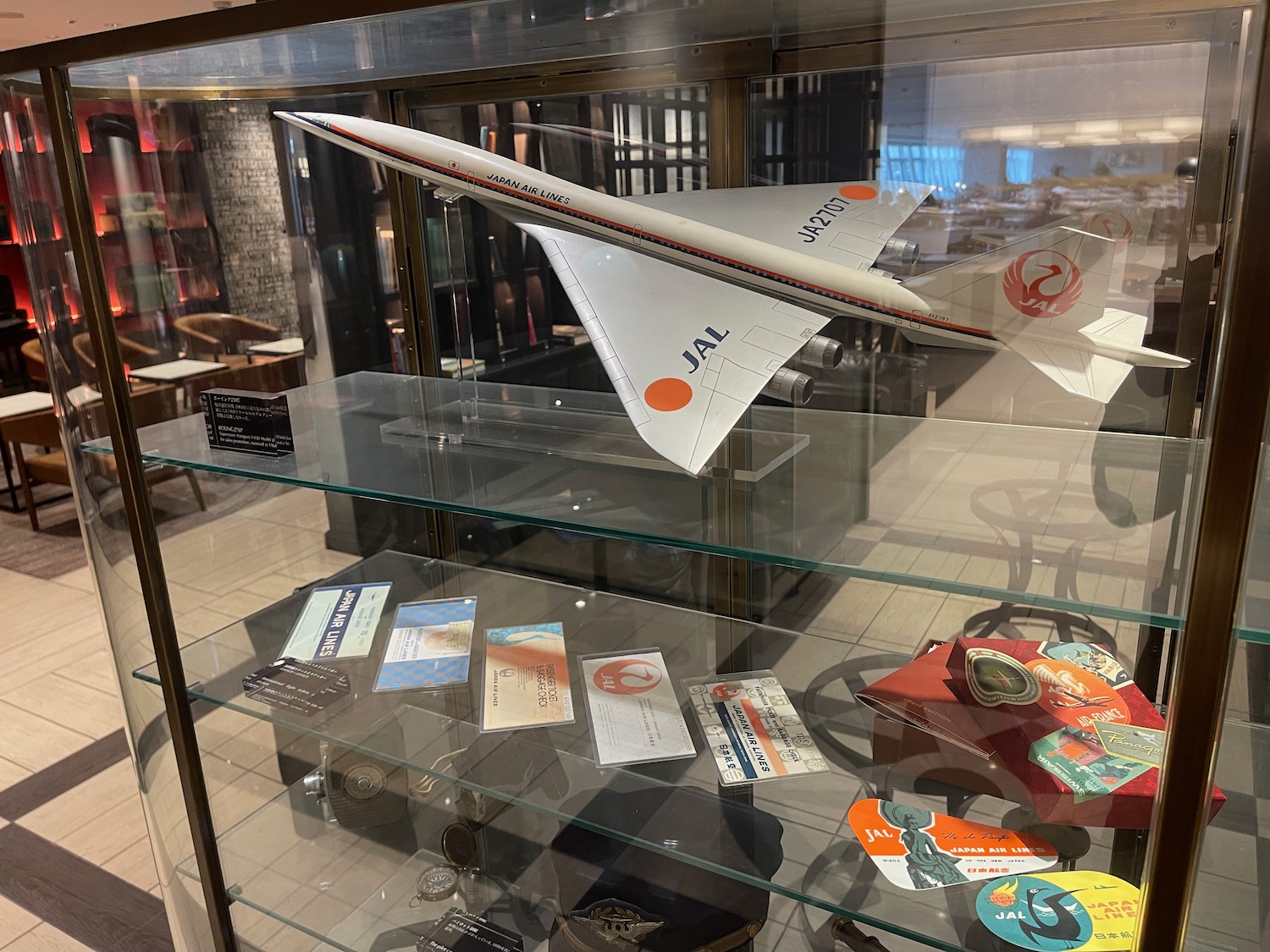 a model airplane on a glass shelf