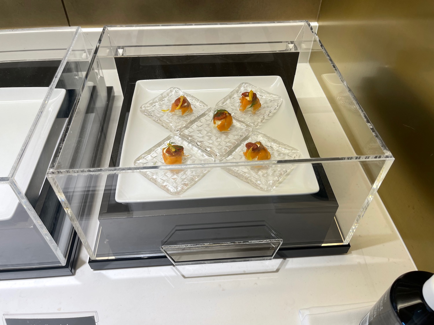 a plate of food in a glass case