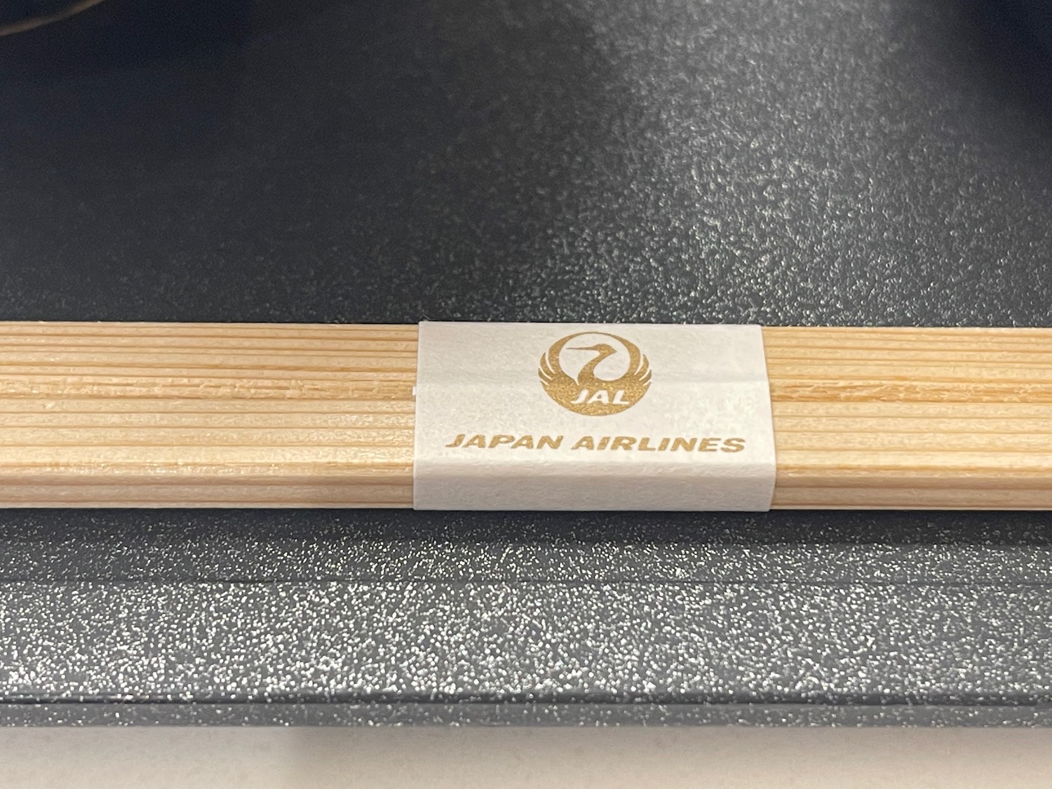 a wooden stick with a white label on it