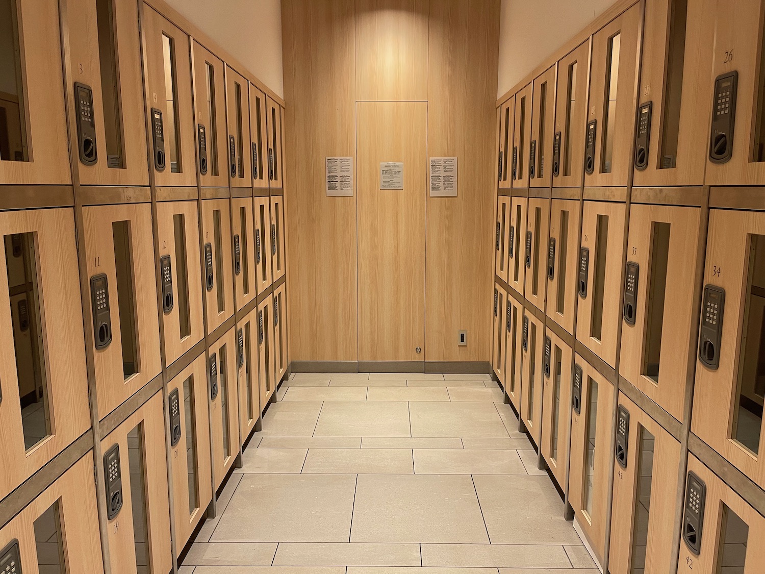 a hallway with lockers and doors