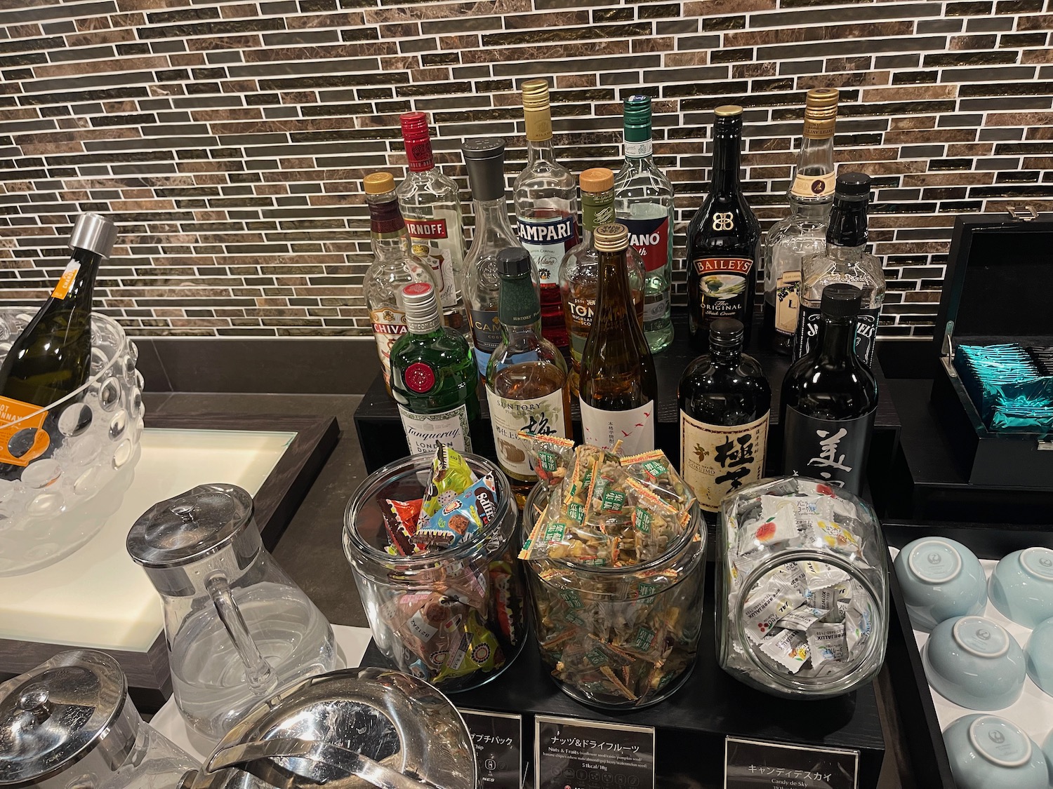 a group of bottles of liquor and candy