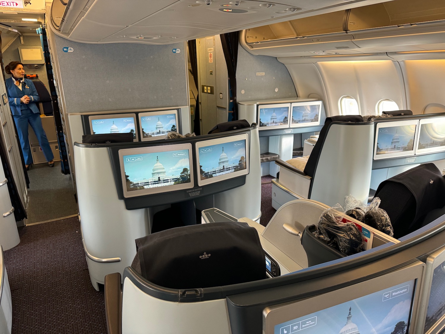 a row of monitors in an airplane