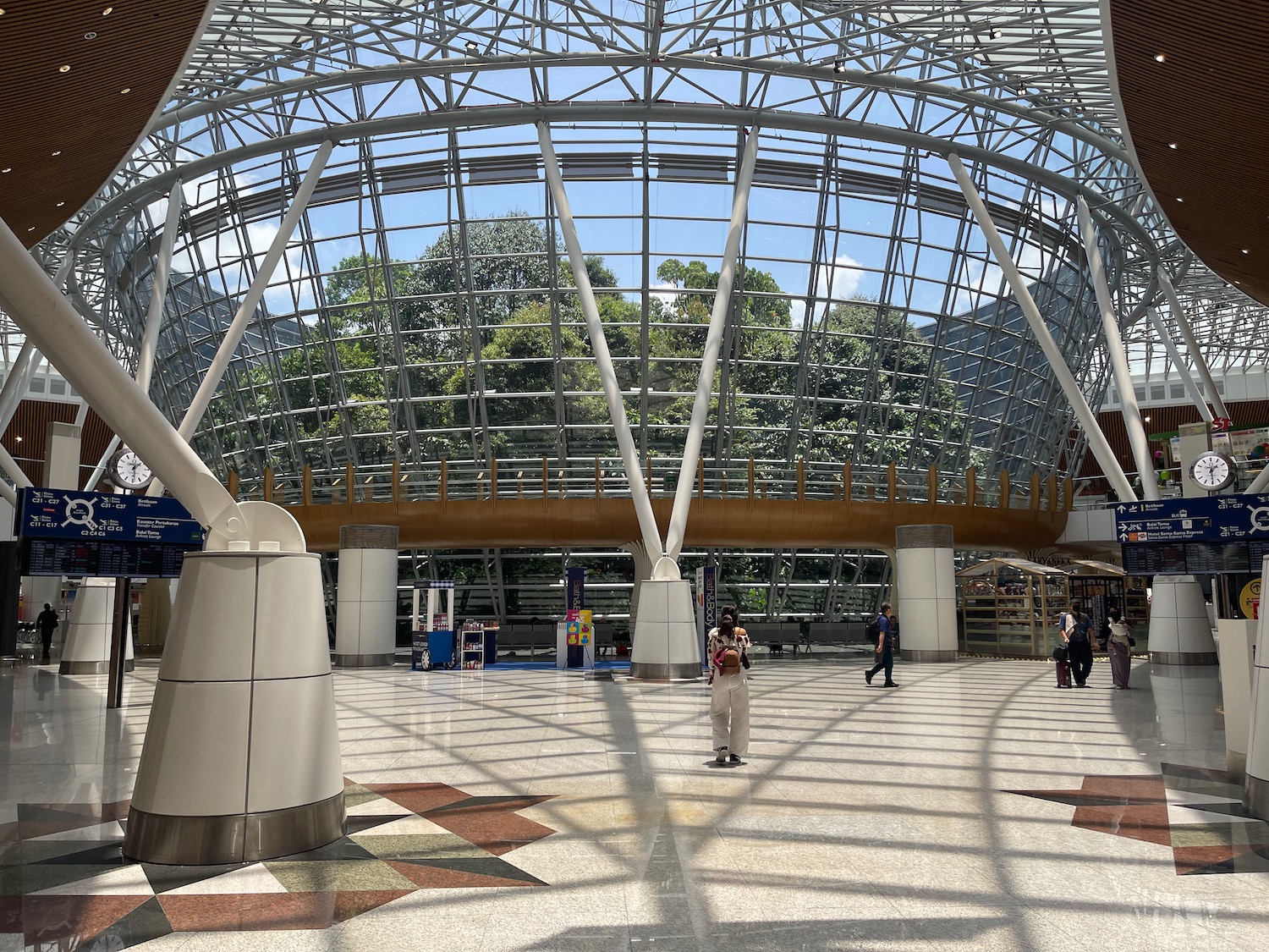 a glass ceiling with people walking around