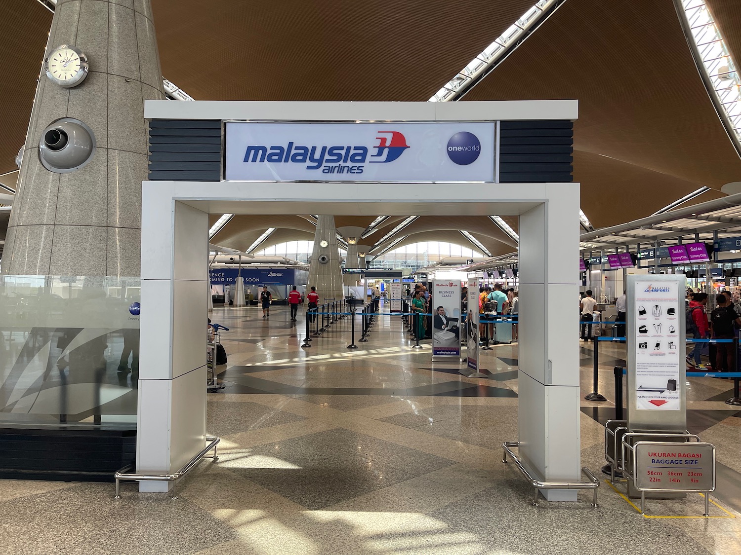 a large airport with people walking around