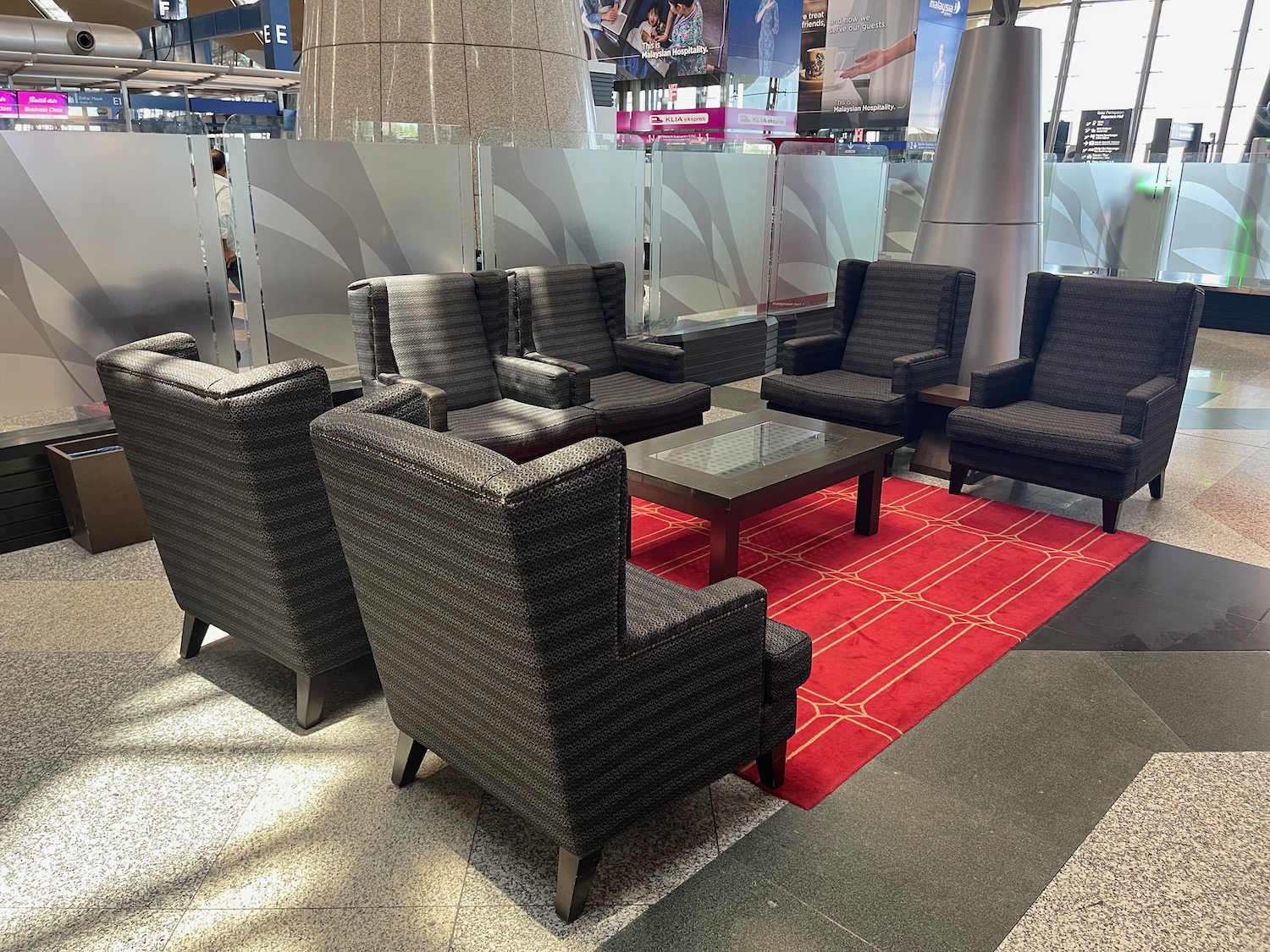 a group of chairs and a table in a room