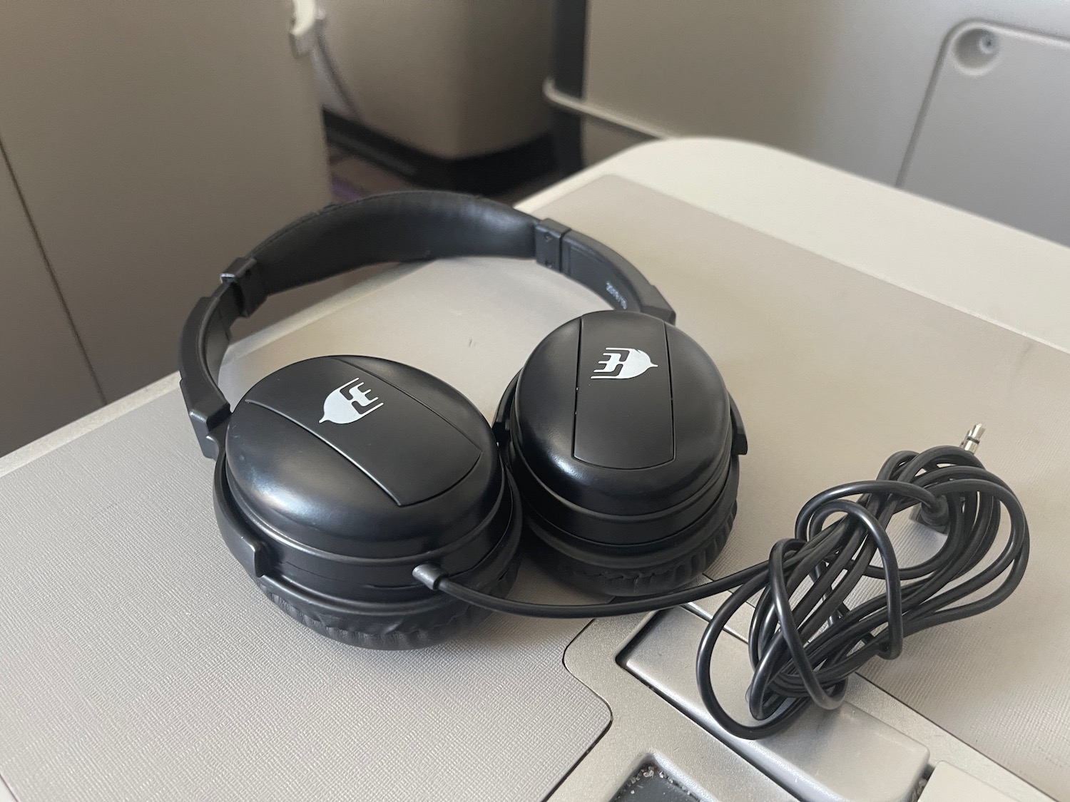 a pair of black headphones on a silver laptop