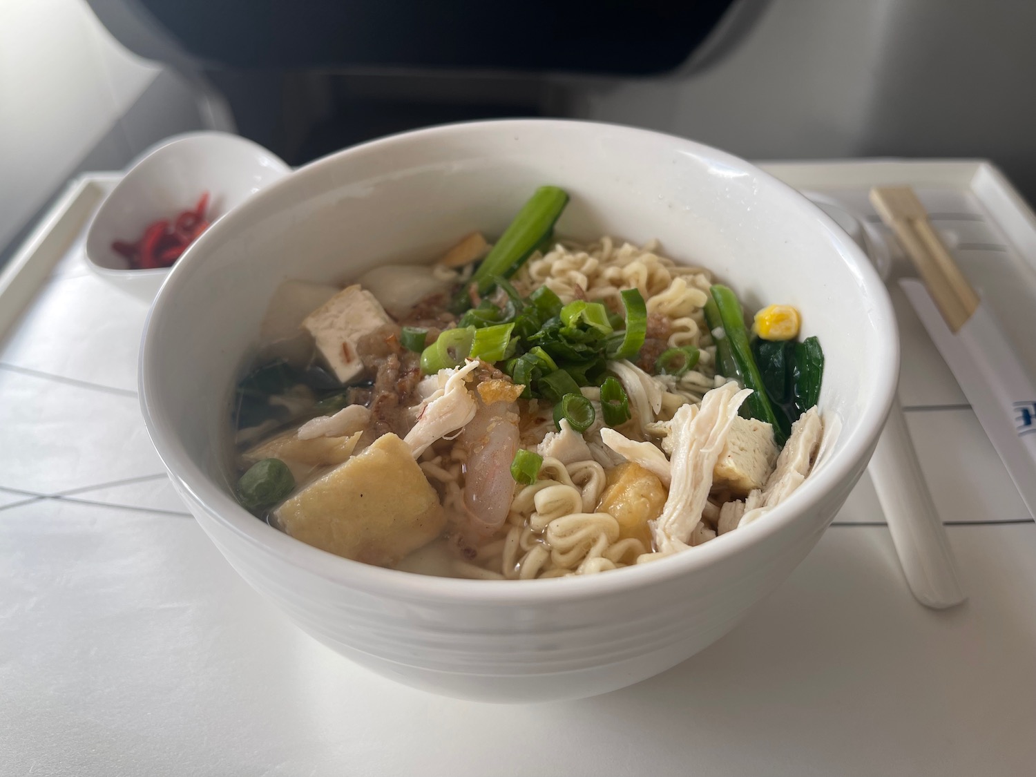 a bowl of soup with noodles and vegetables