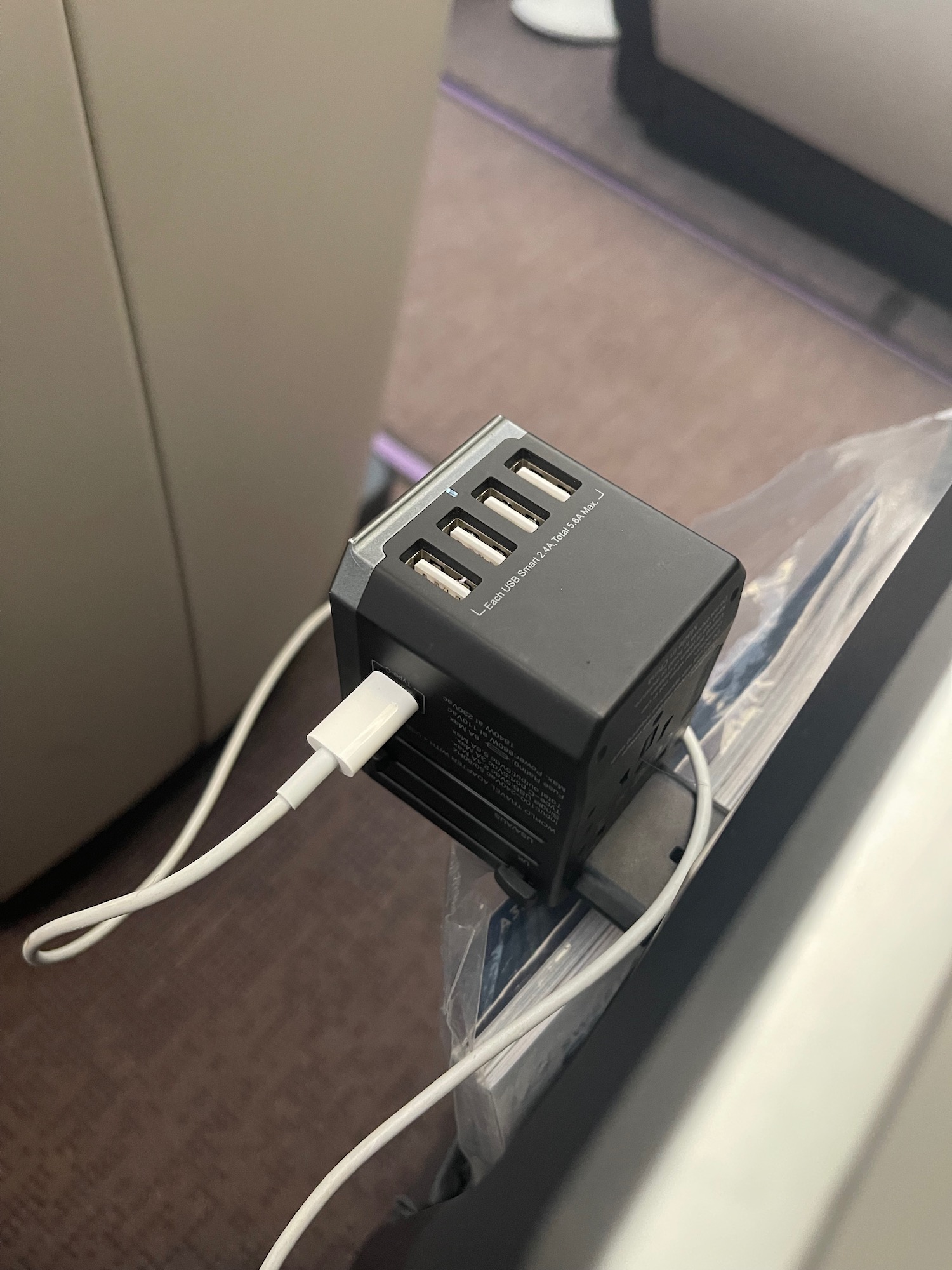 a black power strip with white wires