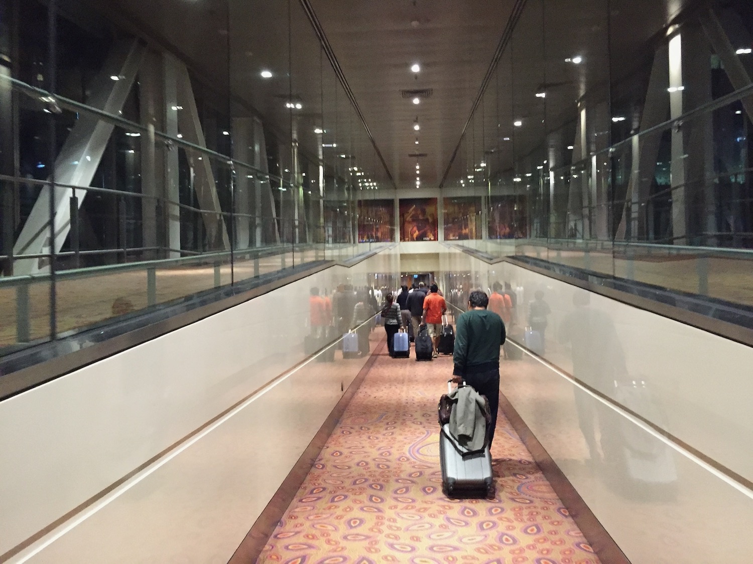 a group of people with luggage in an airport