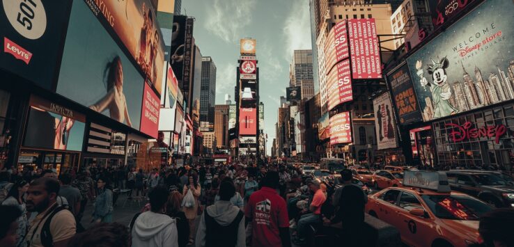 a crowd of people in a busy city