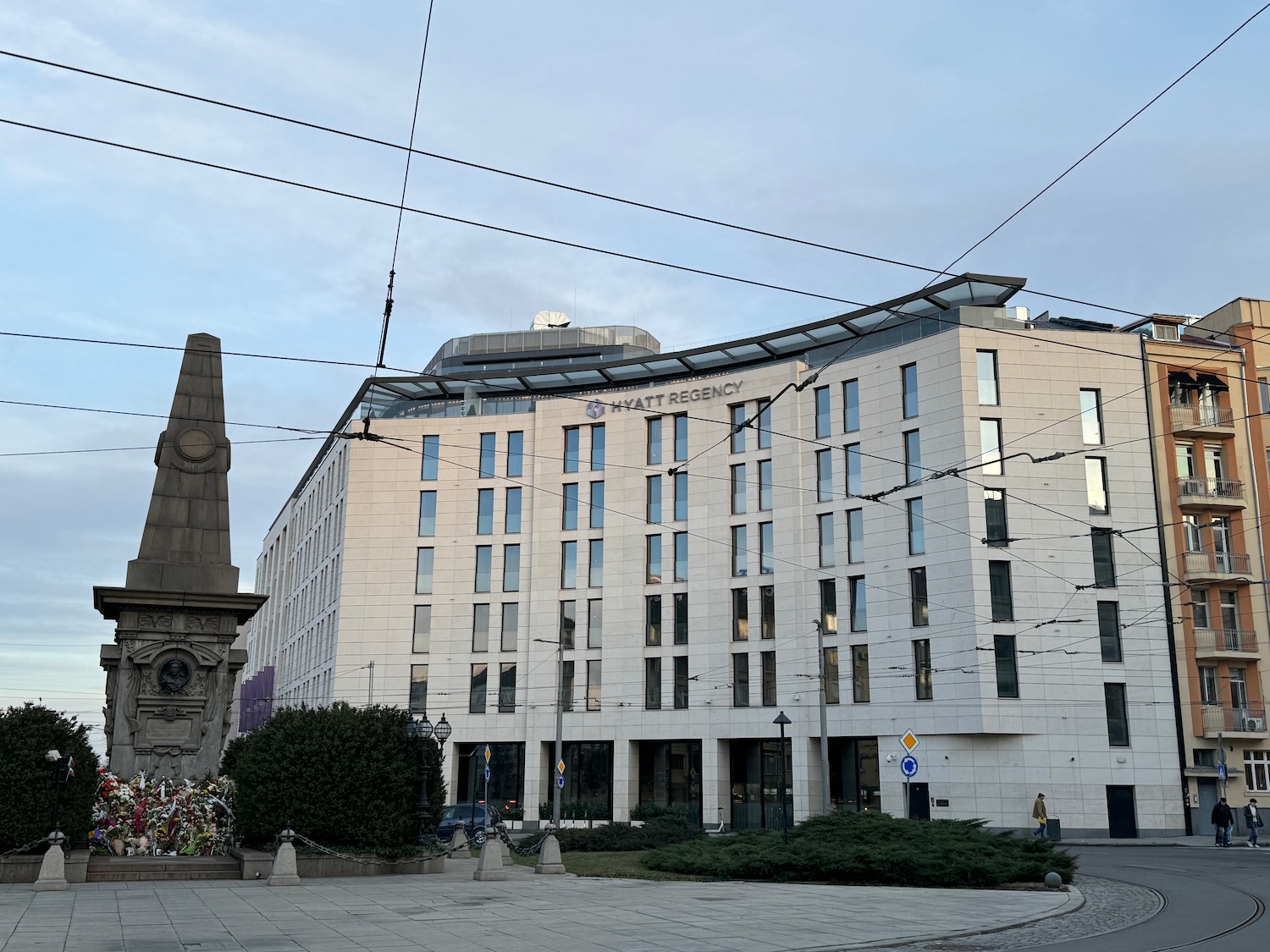 a building with a monument and a statue