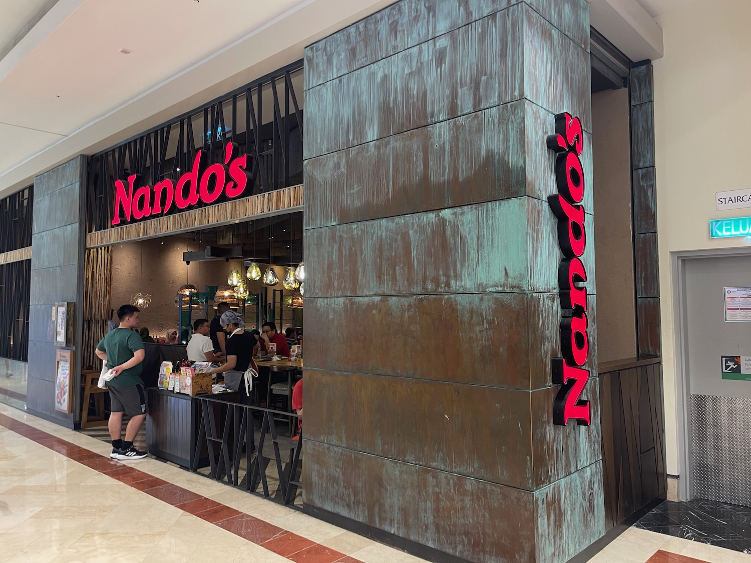 a building with a large wall and a large sign