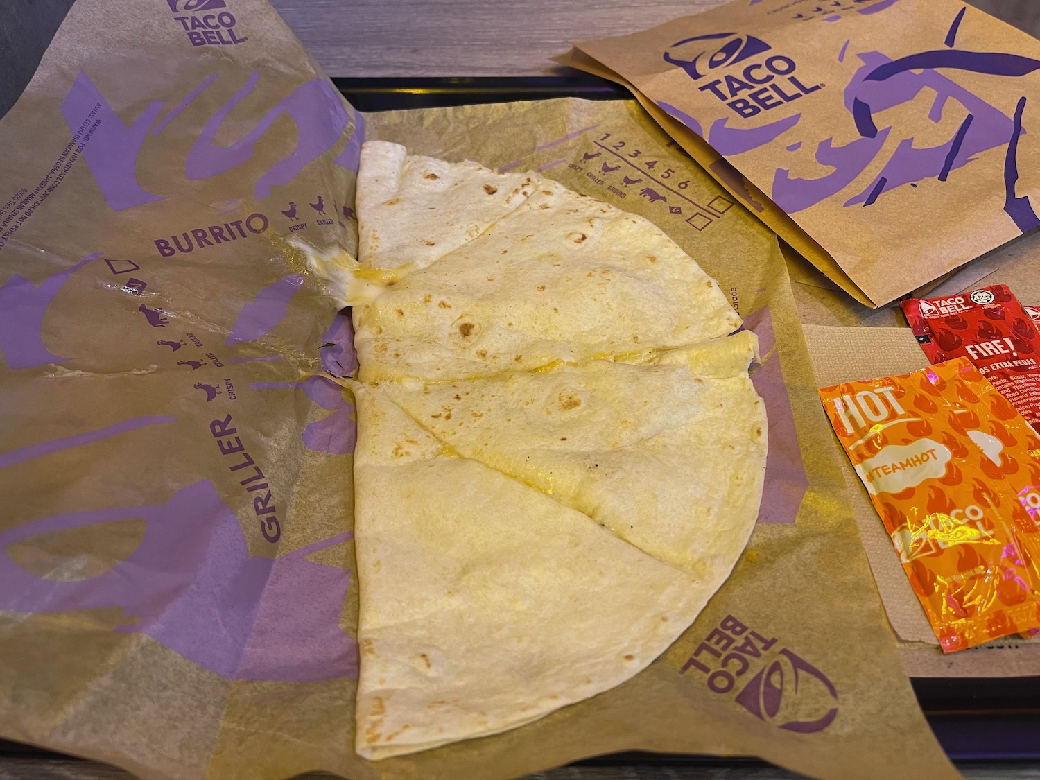 a tortilla on a paper wrapper